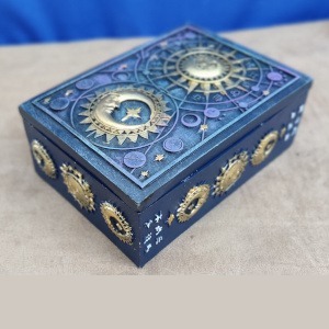 Resin box blue with raised celestial design and gold coloured sun and moon